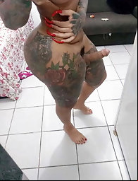 Enchanting shemale cutie is spreading her bum on picture